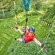 A woman reaching out for a rope while zip lining in Amsterdam